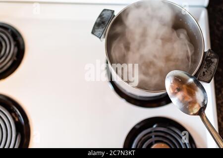 Charlottesville, USA - October 26, 2020: Old retro vintage electric oven  stove with stainless steel knobs dials closeup in kitchen by Kenmore  company Stock Photo - Alamy