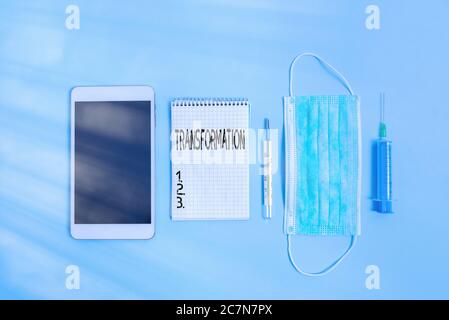 Writing note showing Transformation. Business concept for a dramatic or sweeping alteration of shape or appearance Set of medical equipment with notep Stock Photo