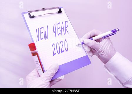 Word writing text New Year 2020. Business photo showcasing Greeting Celebrating Holiday Fresh Start Best wishes Laboratory blood test sample shown for Stock Photo