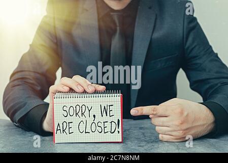 Writing note showing Sorry, We Are Closed. Business concept for apologize for shutting off business for specific time Model displaying different empty Stock Photo