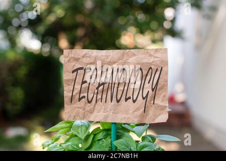 Word writing text Technology. Business photo showcasing use of scientific knowledge for practical purposes in industry Plain empty paper attached to a Stock Photo