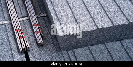 Close-up of a grey granite block with folding rule. Ideal as header for homepages o background for construction companies Stock Photo
