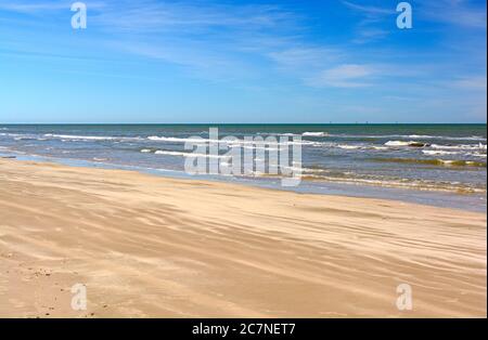 Waves and Sand on a Remote Beach on Padre Island National Seashore on the Gulf Coast of Texas Stock Photo