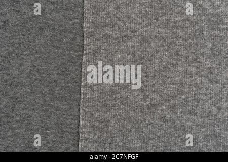 Woolen gray warm material close-up. Abstract background. The concept of comfort and warmth. Copyspace Stock Photo