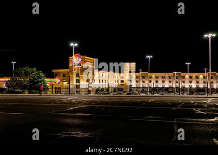 Wendover, USA - July 27, 2019: Nevada city near Utah border with Rainbow Casino exterior architecture at dark black night illuminated neon lights Stock Photo