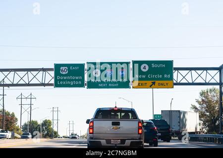 Lexington, USA - October 17, 2019: Highway in city with cars in traffic signs for downtown exits for new circle road driving point of view Stock Photo