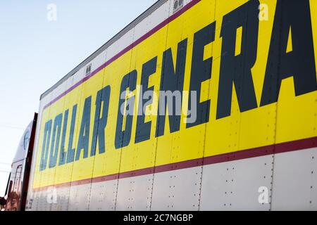 Lexington, USA - October 17, 2019: Highway road with closeup side view of dollar general store advertisement delivery truck in traffic with large text Stock Photo