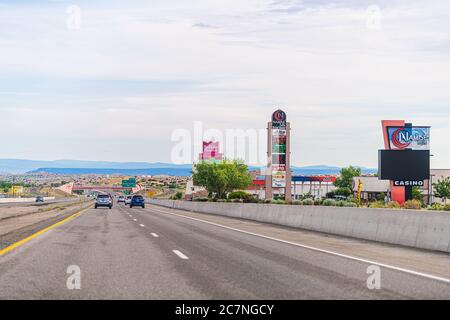 Frontage, USA - June 17, 2019: City near Santa Fe with gas station prices and Nambe Falls Casino gambling building by highway road 285 traffic and sig Stock Photo