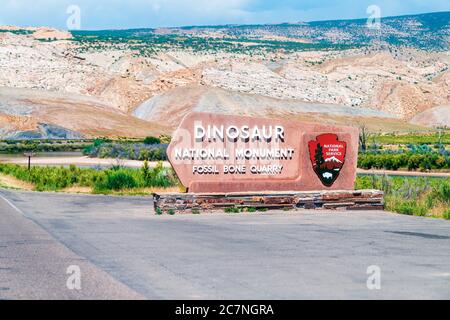 Jensen, USA - July 24, 2019: Sign for welcome to Utah Dinosaur National Monument Park Fossil Bone Quarry on road highway Stock Photo