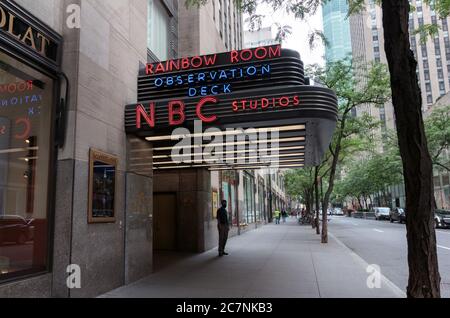 neon sign over the entrance to the Rainbow Room, Observation Deck, and NBC Studios at Rockefeller Center or Centre Stock Photo