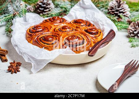 Traditional Christmas poppy cake in Christmas decorations. Christmas food concept. Stock Photo