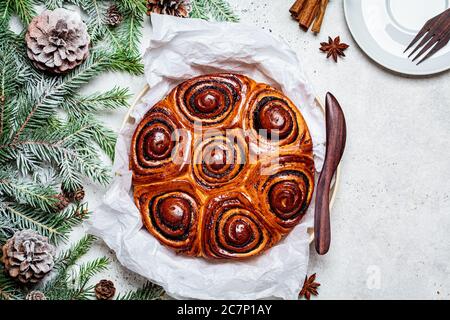 Traditional Christmas poppy cake in Christmas decorations. Christmas food concept. Stock Photo