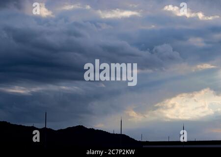 The cloud front ended up lit in a way giving it a false appearance of being painted. Stock Photo