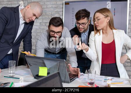 Successful business partners having a meeting and discussing new business project ideas in an office Stock Photo