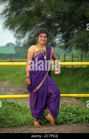 Beautiful Indian young girl in Traditional Saree posing outdoors 4976104  Stock Photo at Vecteezy