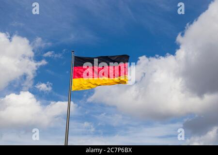 Germany flag on the blue sky background, Berlin, Germany Stock Photo