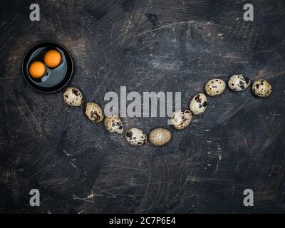 Quail eggs with yolks in the shape of snake.  Stock Photo