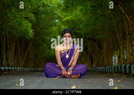 Indian Traditional Beautiful young girl in saree posing outdoors Stock  Photo - Alamy