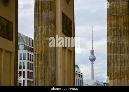 A view of Fernsehturm or TV Tower through Brandenburg Gate in Berlin, Germany