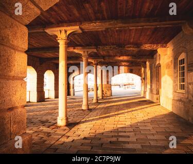 Sunset under the arches in the Royal William Victualling Yard in Devonport Stock Photo