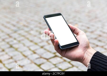 Man uses his Mobile Phone outdoor, close up Stock Photo
