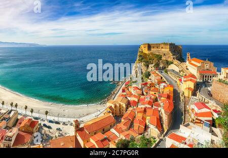 Beautiful seaside town village Scilla with old medieval castle on rock Castello Ruffo, colorful traditional typical italian houses on Mediterranean Ty Stock Photo