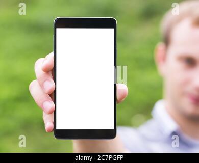 Young man showing a mobile phone application, close up Stock Photo