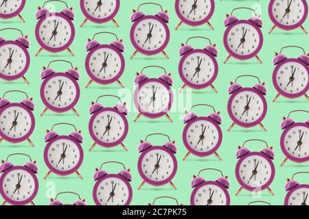 Many alarm clocks on color background Stock Photo