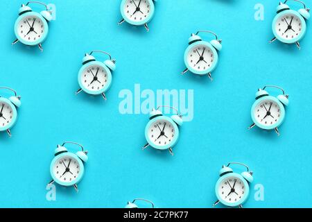 Many alarm clocks on color background Stock Photo