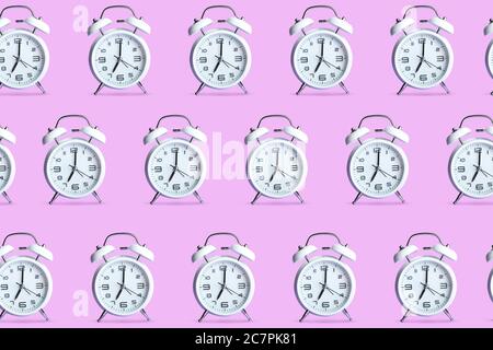 Many alarm clocks on color background Stock Photo