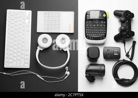 Different modern devices on black and white background Stock Photo