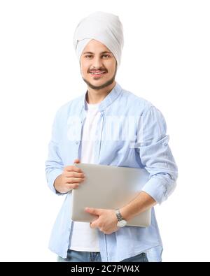 Handsome young Indian man with laptop on white background Stock Photo