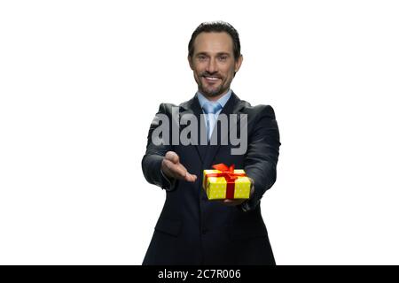 Attractive boss handing a present. Stock Photo