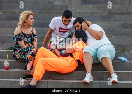 Gyumri , Armenia - August 15, 2019 : young people discussing in  Kalbasi Park landmark of Gyumri Shirak Armenia eastern Europe Stock Photo