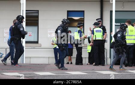 Counter Terrorist Specialist Firearms Officers at the Royal Sussex County Hospital in Brighton, a man has been arrested on suspicion of attempted murder after a member of hospital staff was stabbed, according to police. Stock Photo