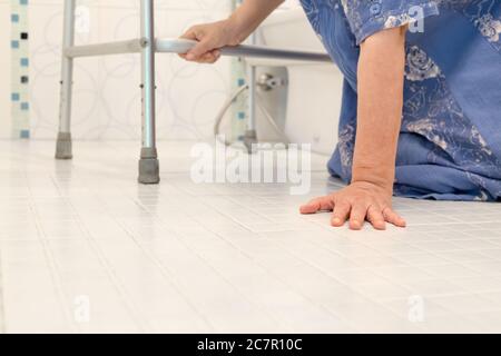 elderly falling in bathroom because slippery surfaces Stock Photo