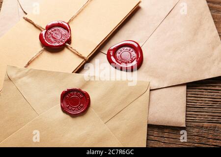 Envelopes with notary public wax seals on table, closeup Stock Photo