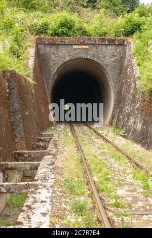 Light at the end of train tunnel Stock Photo