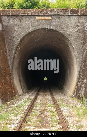 Light at the end of train tunnel Stock Photo