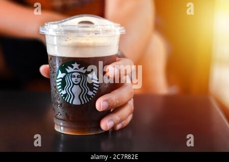 Chon Buri, Thailand - October 14, 2018: : Starbucks coffee brand logo on cold brew beverage cup. Starbucks is the world's largest coffee house with ov Stock Photo