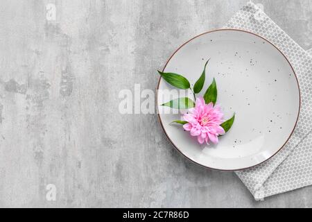 Beautiful table setting on grey background Stock Photo