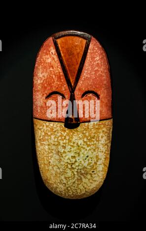 Santa Cruz de Tenerife/Spain; March 22 2019: Antique  african Bakwele wooden mask, from Gabon,  on black wall surface Stock Photo