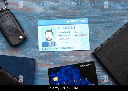 Driving license with car key and credit card on wooden background Stock Photo