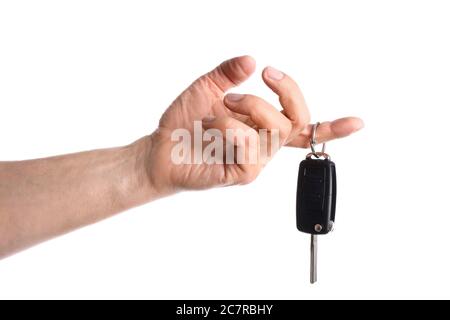 Male hand with car key on white background Stock Photo