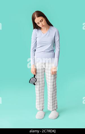 Female sleepwalker on color background Stock Photo