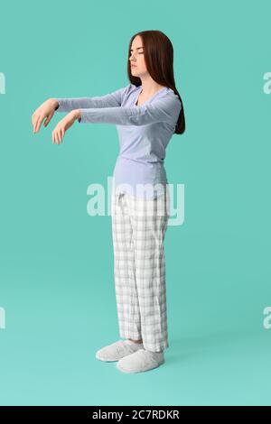 Female sleepwalker on color background Stock Photo