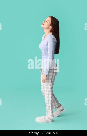 Female sleepwalker on color background Stock Photo