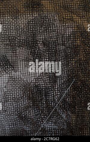 Closeup shot of many metal wire meshes laying on top of each other Stock Photo