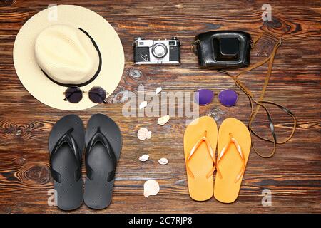 Set of beach accessories on wooden background Stock Photo