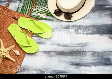 Set of beach accessories on wooden background Stock Photo